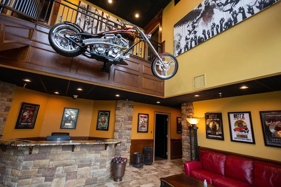 Inside Strange Music - chopper motorcycle and gold records